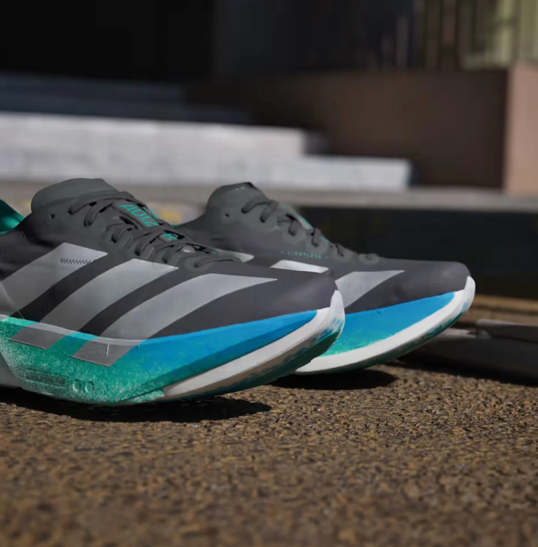adidas Black Running Shoes with Silver Stripes and Blue-Green Sole