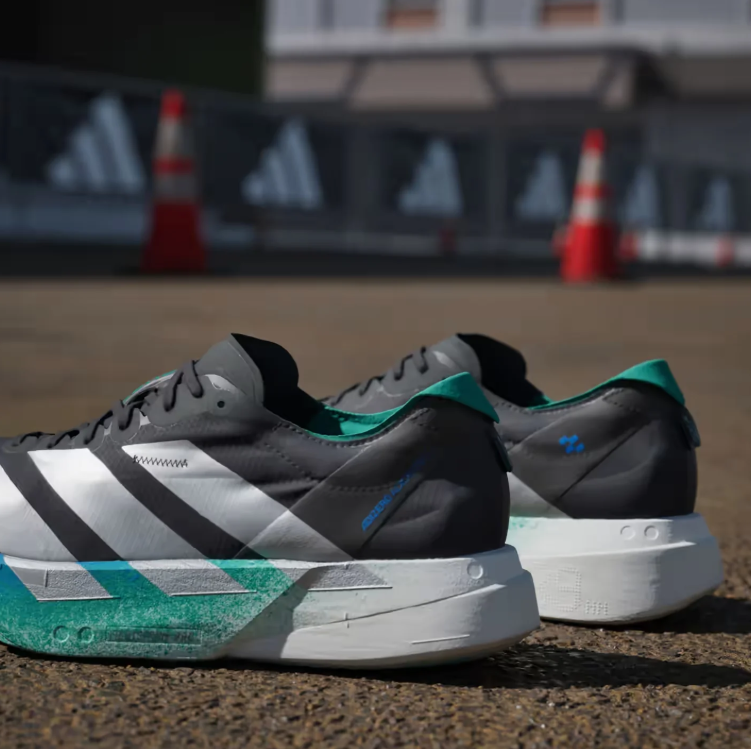 adidas Black Running Shoes with Silver Stripes and Blue-Green Sole