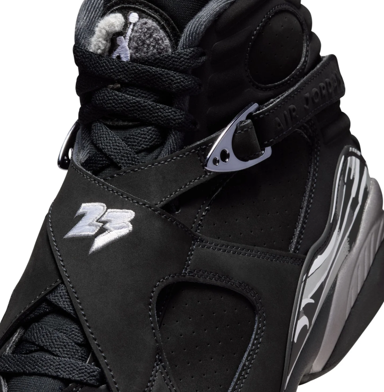 Air Jordan Black High-Top Sneakers with Cross Straps and Silver Accents