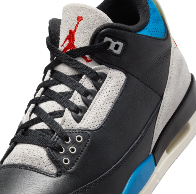 Air Jordan Black Sneakers with Bright Blue and Red Accents
