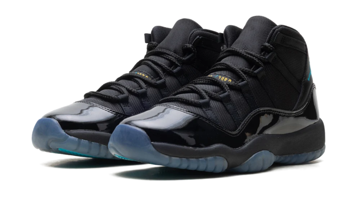 Air Jordan Black High-Top Sneakers with Glossy Trim and Teal Accents