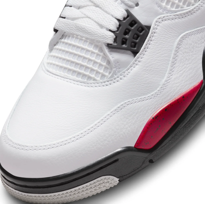 Air Jordan White Sneakers with Speckled Red and Black Accents