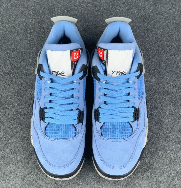 Air Jordan 4 Blue Sneakers with Speckled Gray and Black Accents