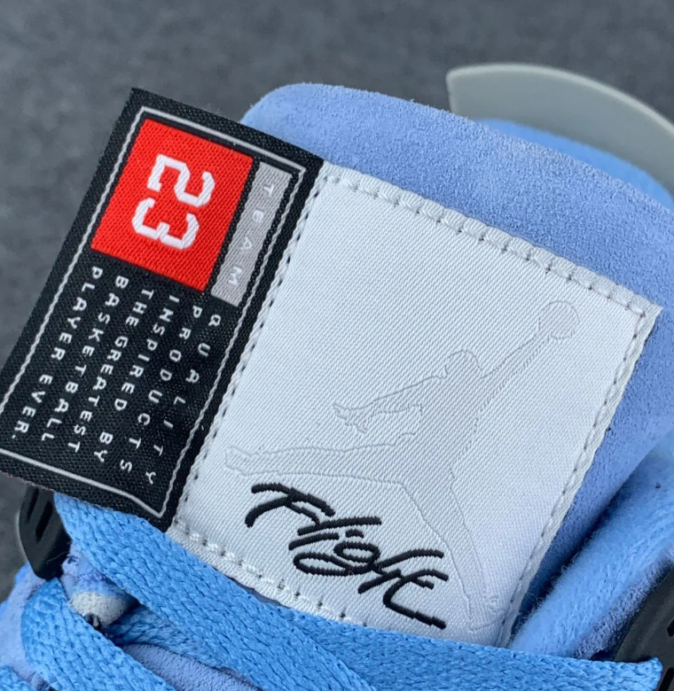 Air Jordan 4 Blue Sneakers with Speckled Gray and Black Accents