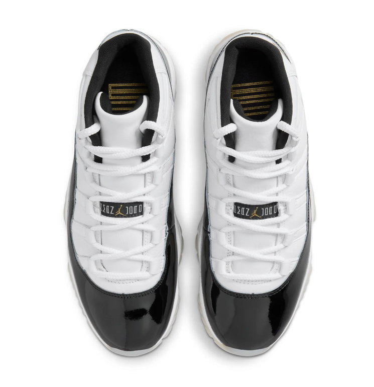 Air Jordan White and Black High-Top Sneakers with Gold Accents