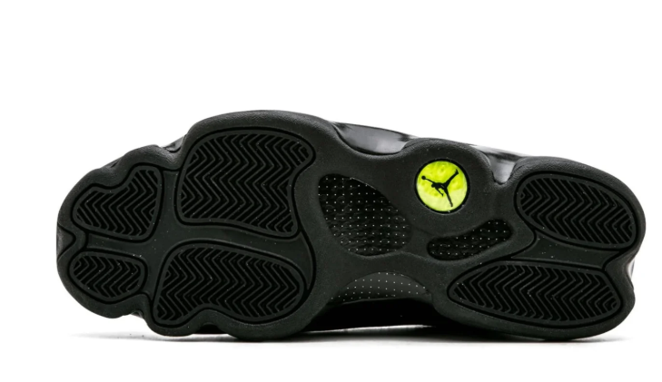 Air Jordan Black High-Top Sneakers with Textured Panels and Green Accents