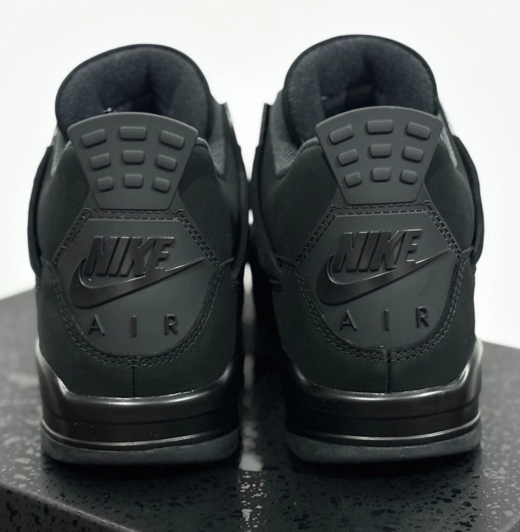 Air Jordan All-Black Sneakers with Grid Panels and Nike Air Heel Detailing