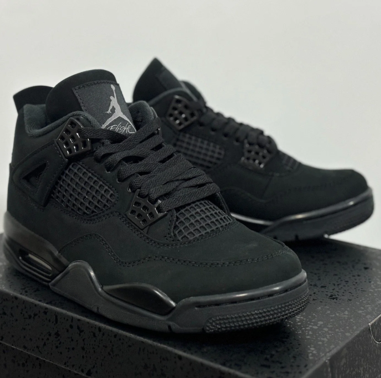 Air Jordan All-Black Sneakers with Grid Panels and Nike Air Heel Detailing
