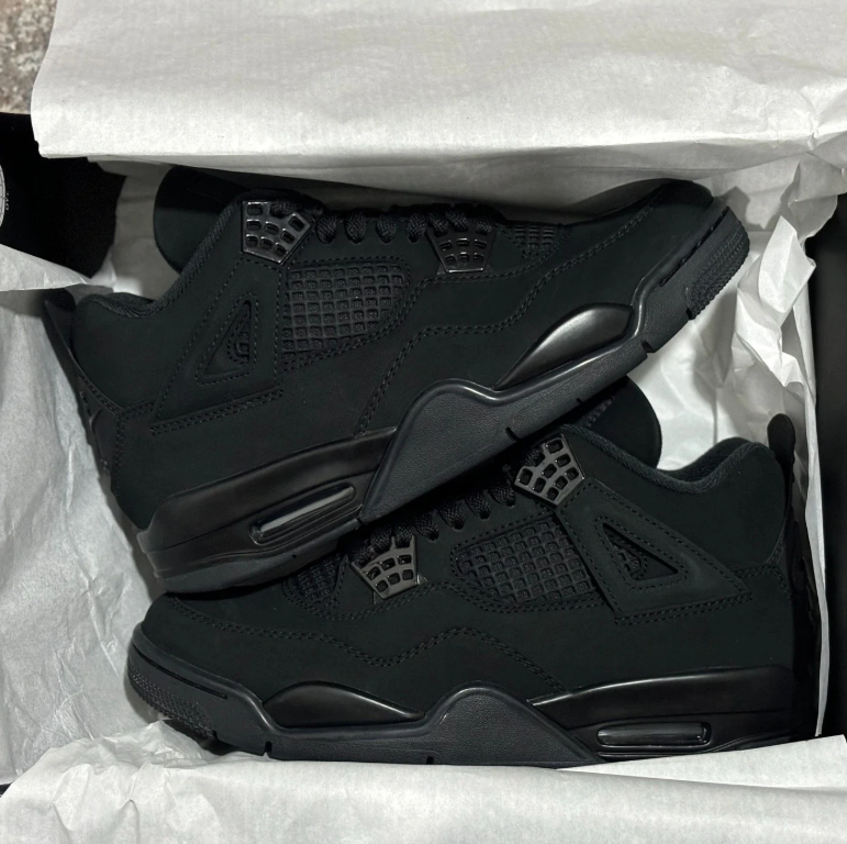 Air Jordan All-Black Sneakers with Grid Panels and Nike Air Heel Detailing