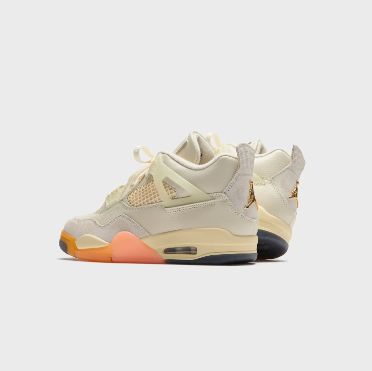 Air Jordan Cream Sneakers with Peach and Orange Sole Accents