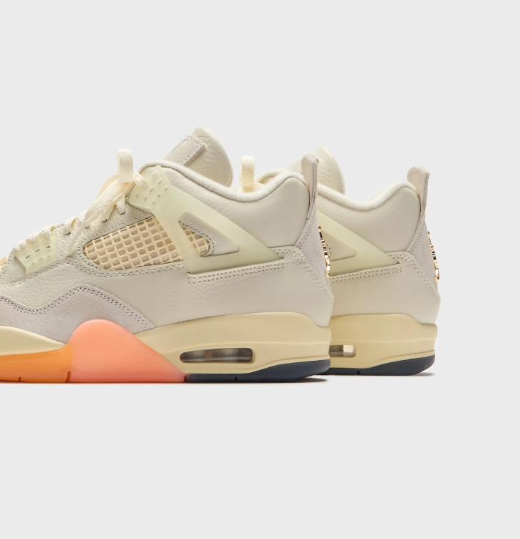 Air Jordan Cream Sneakers with Peach and Orange Sole Accents